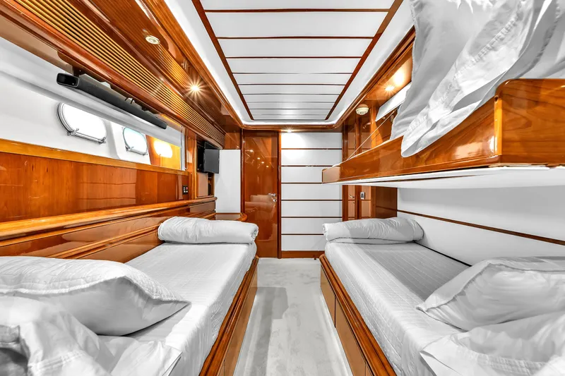 Sinpatico Yacht Photos Pics Luxurious cabin interior of 2002 Ferretti Yachts Custom Line 94 with wooden finishes.