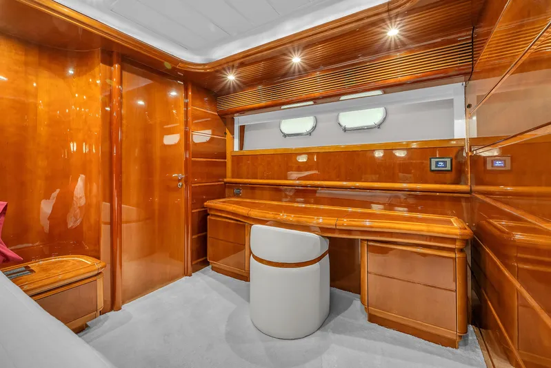 Sinpatico Yacht Photos Pics Luxurious wooden interior of 2002 Ferretti Yachts Custom Line 94 cabin with desk and seating.