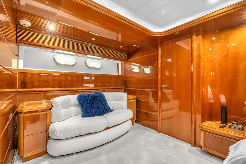 Sinpatico Yacht Photos Pics Luxurious interior of 2002 Ferretti Yachts Custom Line 94 with plush seating and wooden finishes.