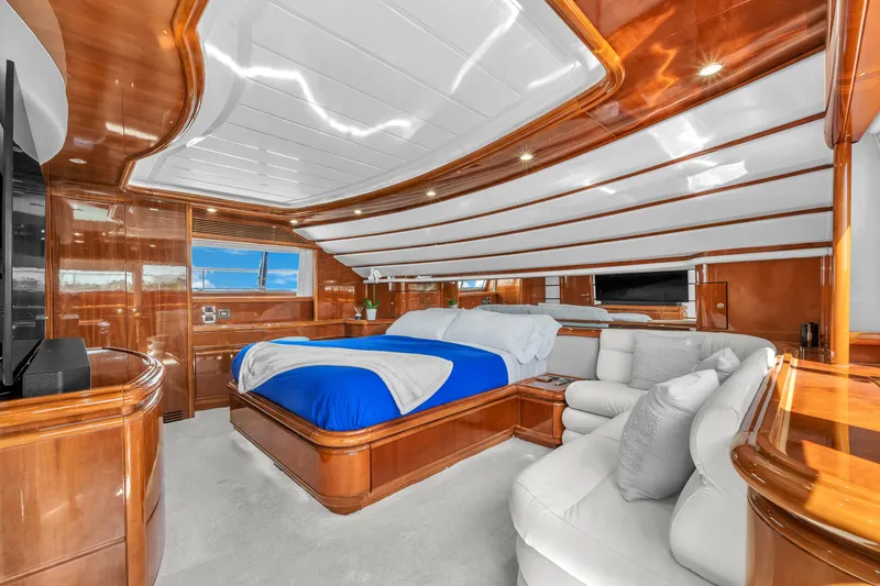Sinpatico Yacht Photos Pics Luxurious 2002 Ferretti Yachts Custom Line 94 interior with elegant wood finish and plush bedding.