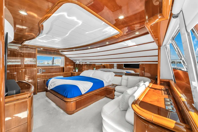 Sinpatico Yacht Photos Pics Luxurious 2002 Ferretti Yachts Custom Line 94 interior with elegant wood finishes and plush bedding.