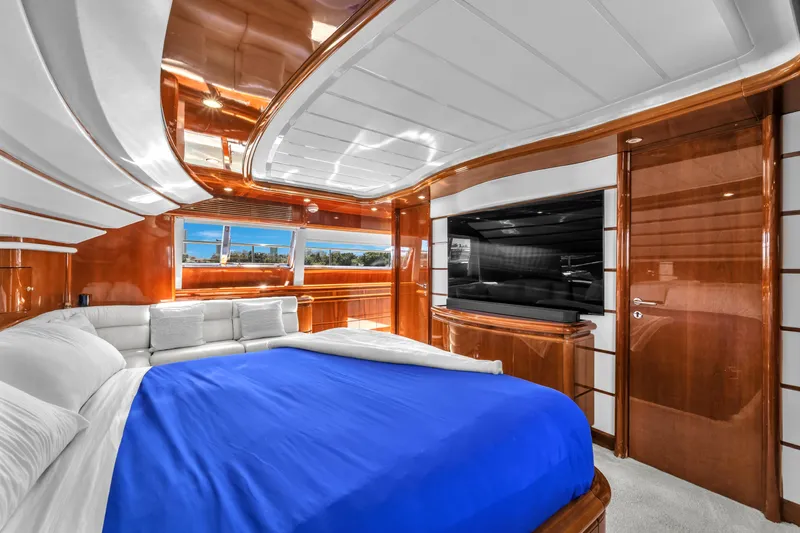 Sinpatico Yacht Photos Pics Luxurious 2002 Ferretti Yachts Custom Line 94 bedroom with elegant wood finish and large TV.