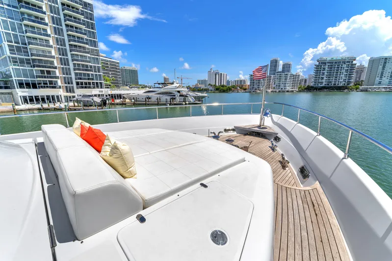 Sinpatico Yacht Photos Pics Luxurious 2002 Ferretti Yachts Custom Line 94 docked near modern waterfront buildings.