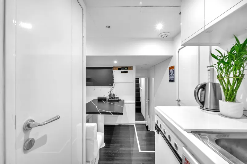 Sinpatico Yacht Photos Pics Luxurious interior of 2002 Ferretti Yachts Custom Line 94, featuring modern kitchen amenities.