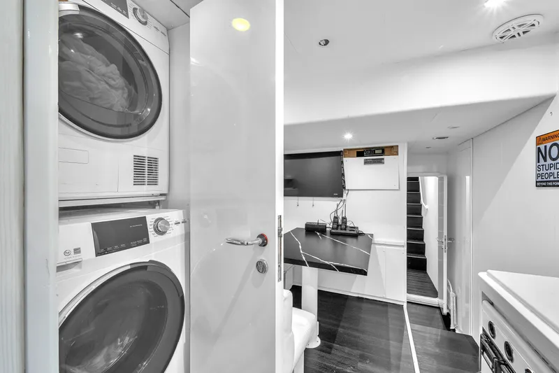 Sinpatico Yacht Photos Pics Laundry area and modern interior on 2002 Ferretti Yachts Custom Line 94.