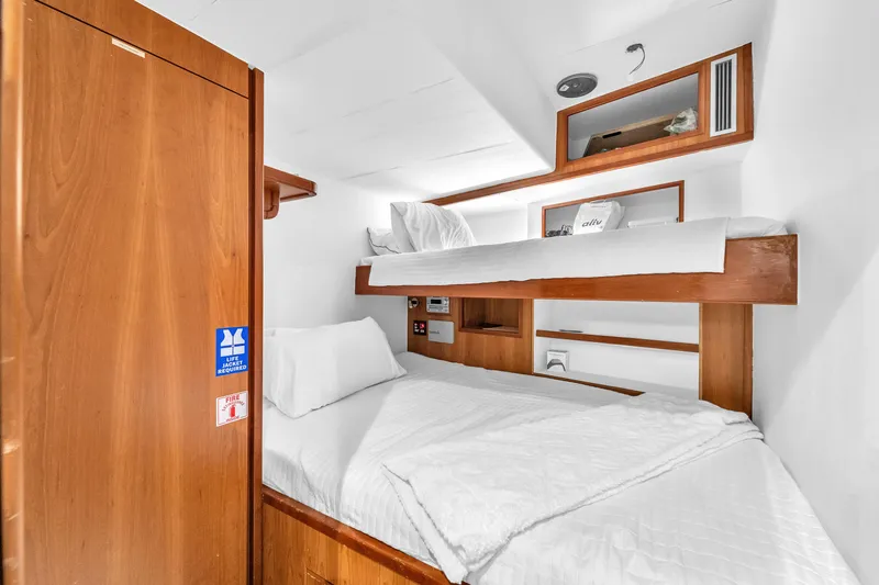 Sinpatico Yacht Photos Pics Cozy cabin with bunk beds on 2002 Ferretti Yachts Custom Line 94.