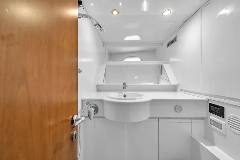 Sinpatico Yacht Photos Pics Luxurious bathroom in 2002 Ferretti Yachts Custom Line 94, featuring modern fixtures and sleek design.