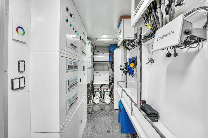 Sinpatico Yacht Photos Pics Engine room of 2002 Ferretti Yachts Custom Line 94 with control panels and Garmin equipment.