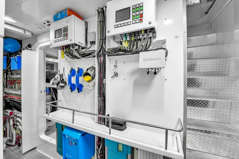 Sinpatico Yacht Photos Pics Engine room of 2002 Ferretti Yachts Custom Line 94 with control panels and equipment.