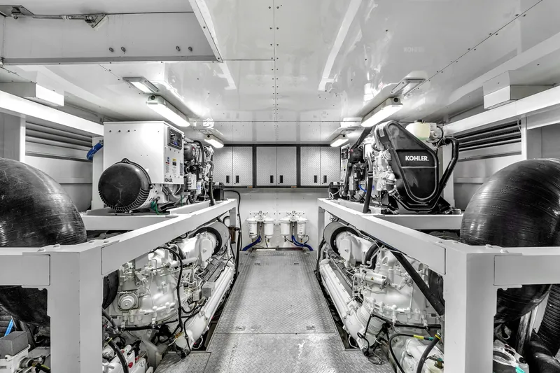 Sinpatico Yacht Photos Pics Engine room of 2002 Ferretti Yachts Custom Line 94, featuring Kohler generators.