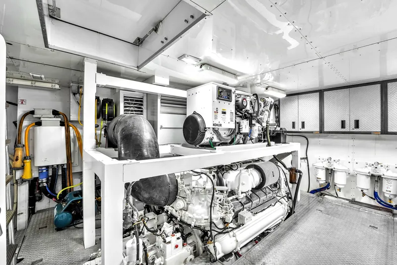 Sinpatico Yacht Photos Pics Engine room of 2002 Ferretti Yachts Custom Line 94, featuring Kohler generator and advanced machinery.