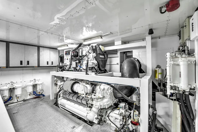 Sinpatico Yacht Photos Pics Engine room of 2002 Ferretti Yachts Custom Line 94, featuring Kohler generator and advanced machinery.