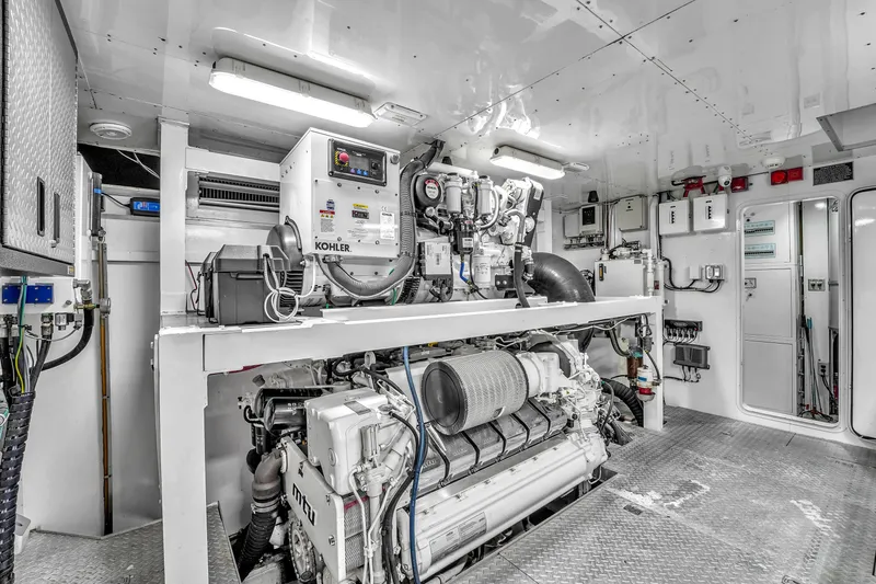 Sinpatico Yacht Photos Pics Engine room of 2002 Ferretti Yachts Custom Line 94, featuring Kohler generator and MTU engine.