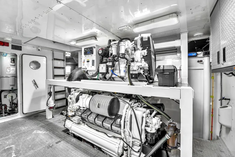 Sinpatico Yacht Photos Pics Engine room of 2002 Ferretti Yachts Custom Line 94, featuring Kohler generator.