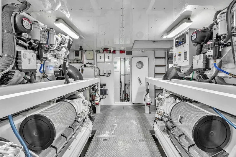 Sinpatico Yacht Photos Pics Engine room of 2002 Ferretti Yachts Custom Line 94, featuring Kohler generators and advanced equipment.