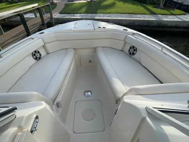  Yacht Photos Pics 2017 Grady-White Freedom 285 boat interior with white seating and speakers.