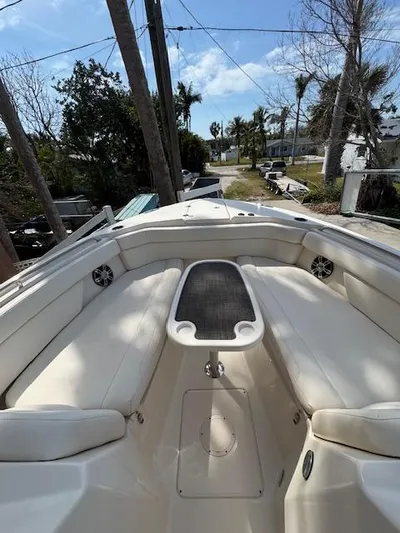  Yacht Photos Pics 2017 Grady-White Freedom 285 boat interior with white seating and table, outdoor setting.