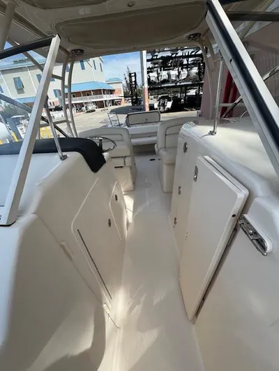  Yacht Photos Pics 2017 Grady-White Freedom 285 boat interior, featuring spacious seating and storage compartments.