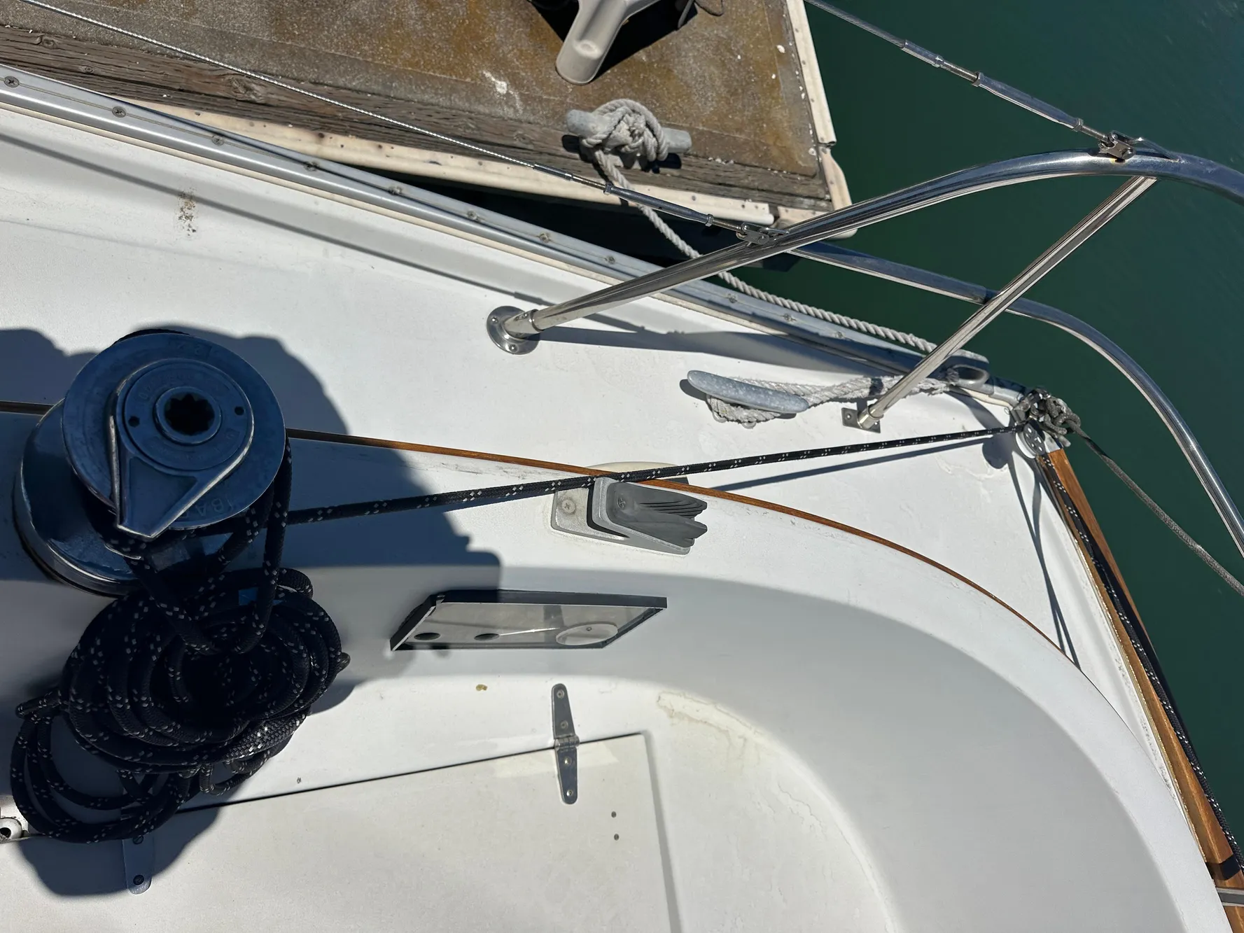 Deck of 1986 Nonsuch Ultra sailboat with winch and ropes.