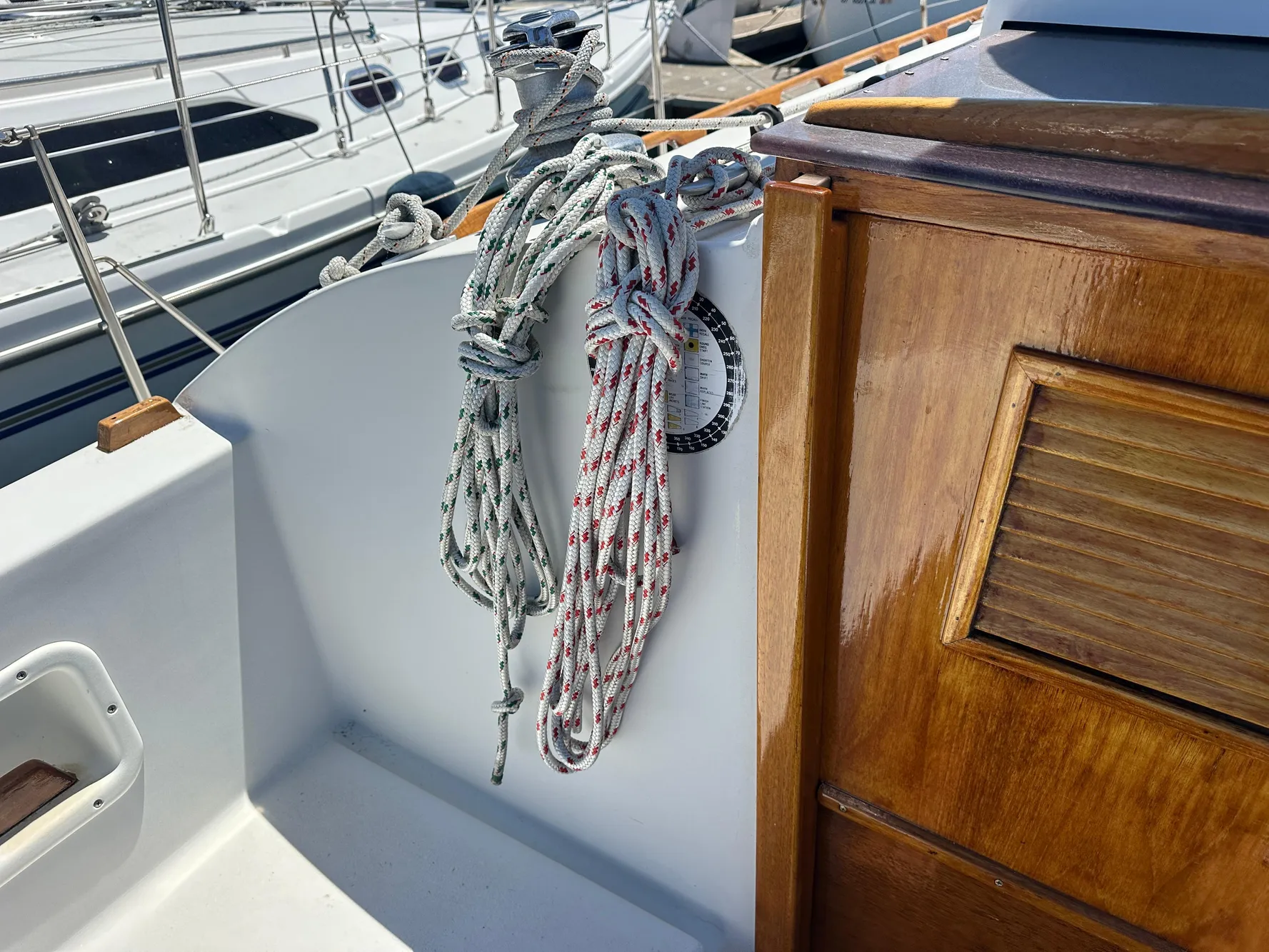 Ropes and wooden panel on 1986 Nonsuch Ultra sailboat deck.