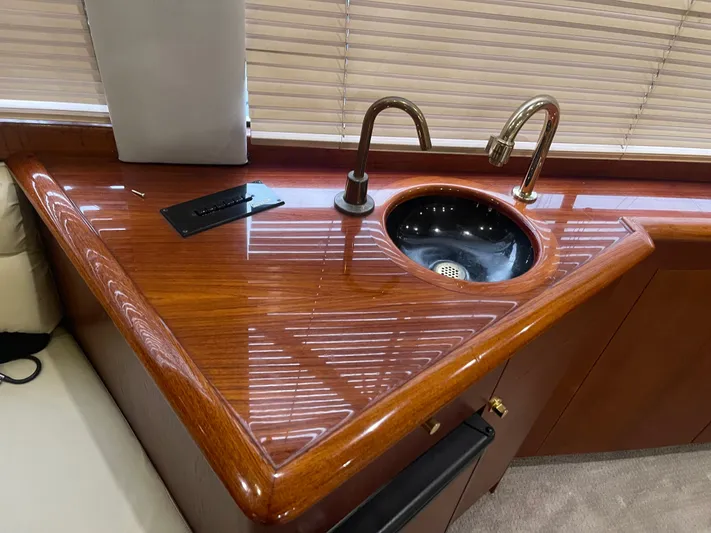  Yacht Photos Pics Luxurious wood countertop with sink on 1996 Ocean Yachts 53 Supersport.
