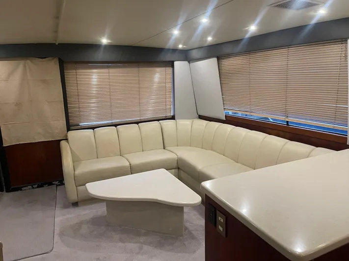  Yacht Photos Pics Interior of 1996 Ocean Yachts 53 Supersport with leather sofa and table.
