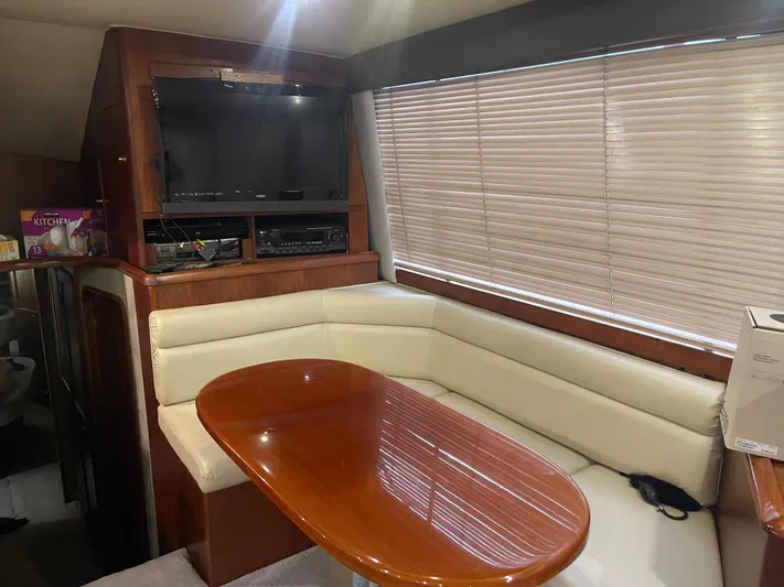  Yacht Photos Pics Interior of 1996 Ocean Yachts 53 Supersport with dining area and TV.