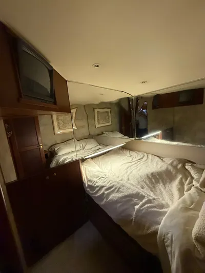  Yacht Photos Pics Interior of a 1996 Ocean Yachts 53 Supersport, cozy bedroom.