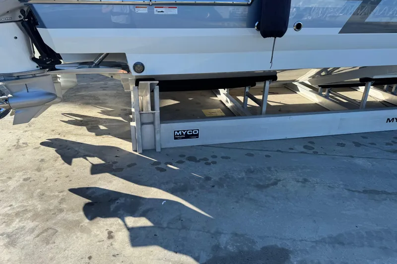 Millennium Falcon Yacht Photos Pics 2023 Formula 400 Super Sport Crossover on Myco trailer, docked on concrete surface.