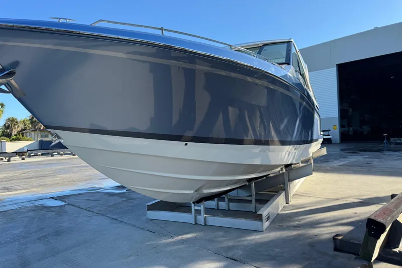 Millennium Falcon Yacht Photos Pics 2023 Formula 400 Super Sport Crossover boat on a dock, side view.