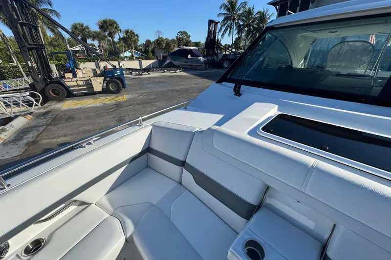 Millennium Falcon Yacht Photos Pics 2023 Formula 400 Super Sport Crossover boat interior with white seating and cup holders.