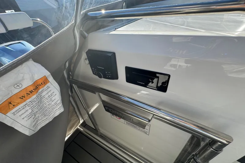 Millennium Falcon Yacht Photos Pics 2023 Formula 400 Super Sport Crossover interior with control panel and warning label.