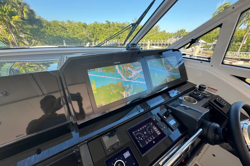 Millennium Falcon Yacht Photos Pics 2023 Formula 400 Super Sport Crossover helm with dual navigation screens and modern controls.