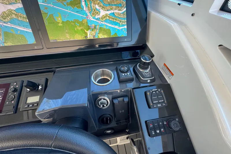 Millennium Falcon Yacht Photos Pics Control panel of 2023 Formula 400 Super Sport Crossover with navigation screens and joystick controls.