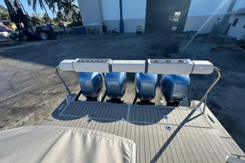 Millennium Falcon Yacht Photos Pics 2023 Formula 400 Super Sport Crossover with four powerful outboard engines at a marina.
