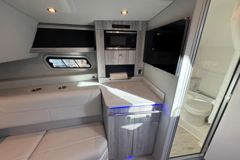 Millennium Falcon Yacht Photos Pics 2023 Formula 400 Super Sport Crossover interior with modern kitchenette and bathroom.