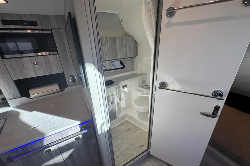 Millennium Falcon Yacht Photos Pics 2023 Formula 400 Super Sport Crossover interior with modern kitchen and bathroom.