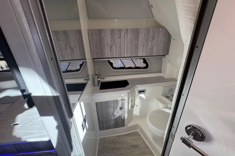 Millennium Falcon Yacht Photos Pics 2023 Formula 400 Super Sport Crossover interior with modern bathroom and sleek cabinetry.