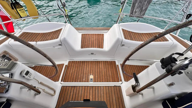 Cadence Yacht Photos Pics Cockpit of 2008 Jeanneau Sun Odyssey 54 DS with teak flooring and dual steering wheels.
