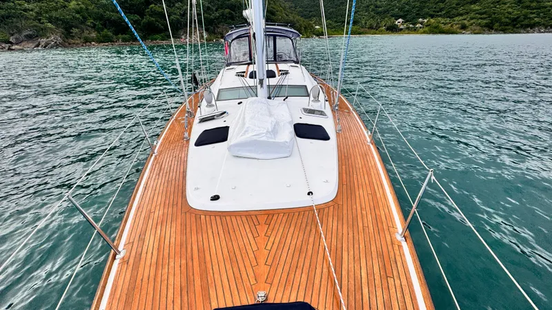 Cadence Yacht Photos Pics 2008 Jeanneau Sun Odyssey 54 DS sailboat with teak deck on calm waters.