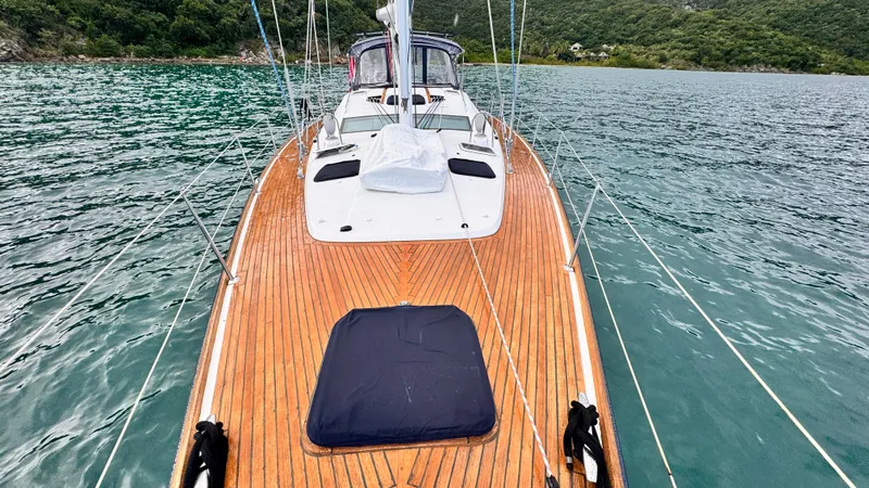 Cadence Yacht Photos Pics 2008 Jeanneau Sun Odyssey 54 DS sailboat with teak deck on calm water.