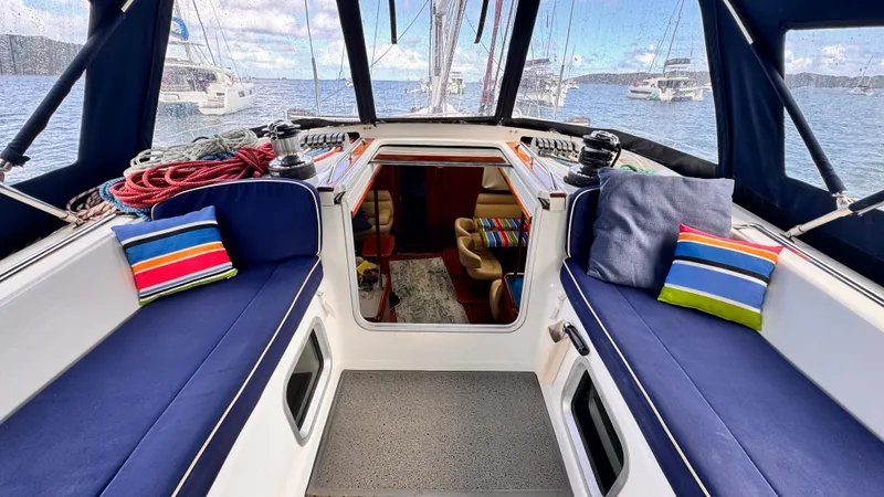 Cadence Yacht Photos Pics Jeanneau Sun Odyssey 54 DS 2008 yacht cockpit with blue seating and colorful cushions.