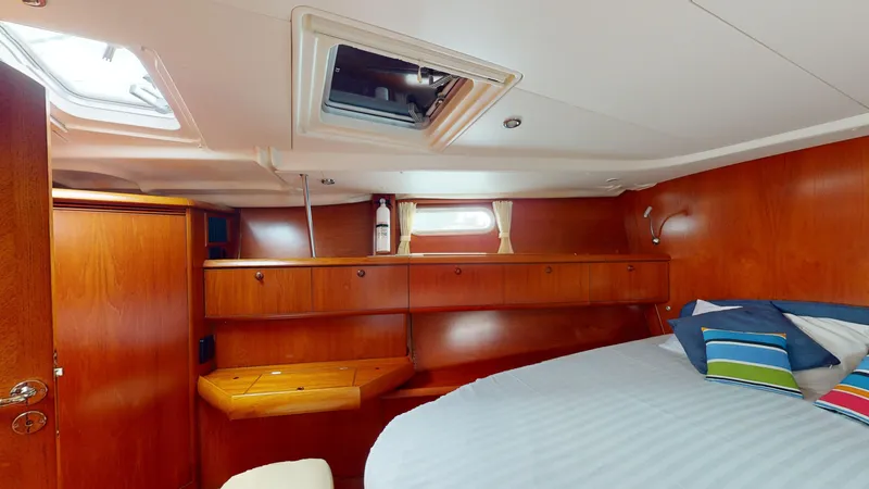 Cadence Yacht Photos Pics Luxurious cabin interior of 2008 Jeanneau Sun Odyssey 54 DS yacht with wood finish.