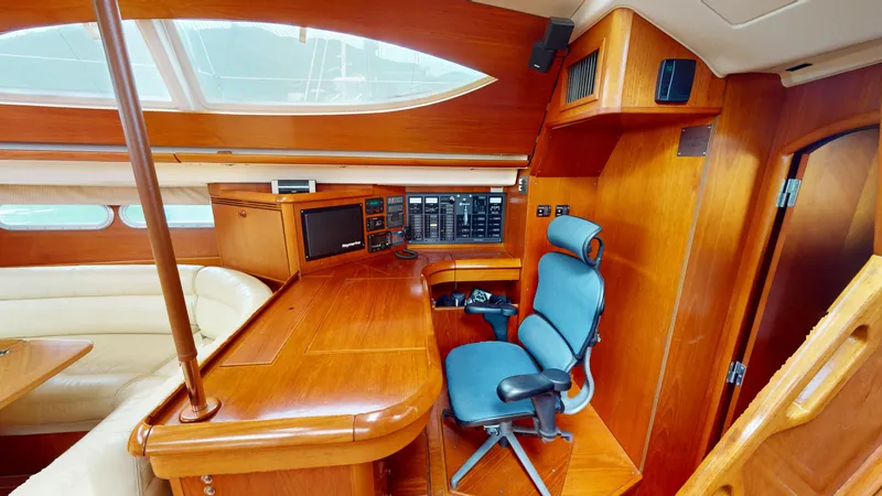 Cadence Yacht Photos Pics Luxurious interior of 2008 Jeanneau Sun Odyssey 54 DS yacht with navigation station.