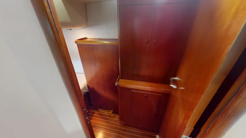 Cadence Yacht Photos Pics Interior of 2008 Jeanneau Sun Odyssey 54 DS, featuring wooden cabinetry and flooring.