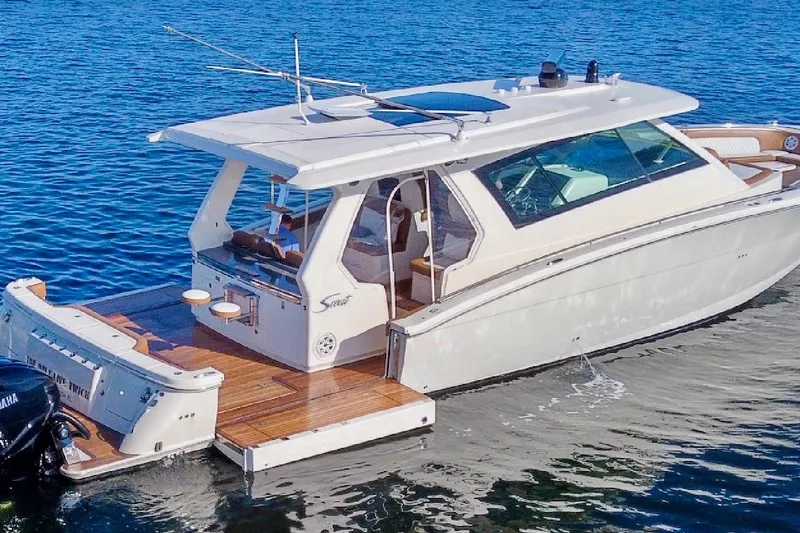 You Only Live Twice Yacht Photos Pics 2020 Scout 530 LXF luxury boat on calm blue water.