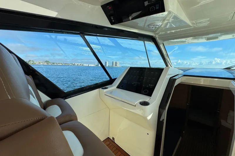 You Only Live Twice Yacht Photos Pics Interior view of 2020 Scout 530 LXF yacht with ocean and cityscape background.