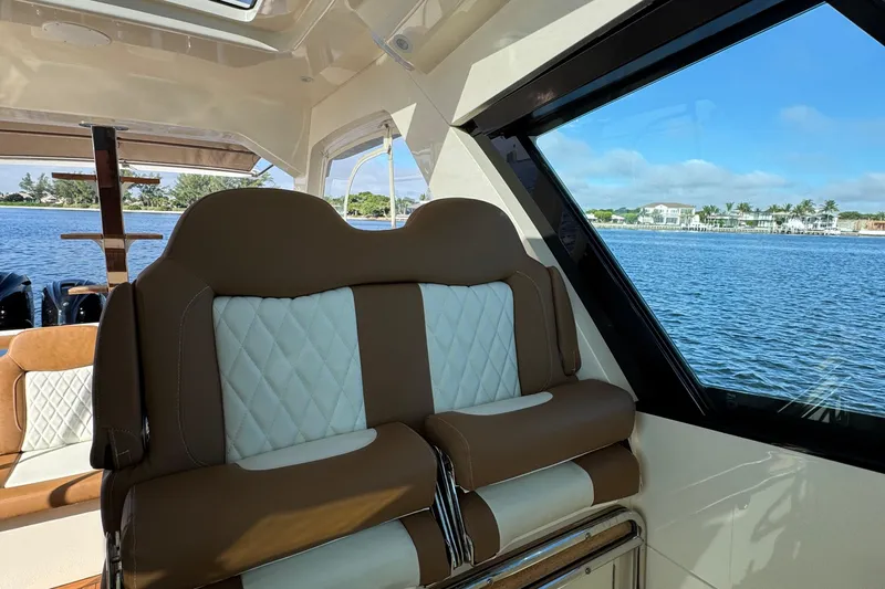 You Only Live Twice Yacht Photos Pics Luxurious interior of 2020 Scout 530 LXF yacht with leather seating and scenic water view.