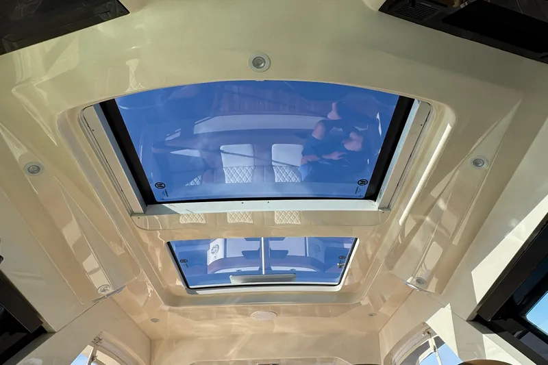 You Only Live Twice Yacht Photos Pics 2020 Scout 530 LXF boat interior with panoramic sunroof and luxurious seating.