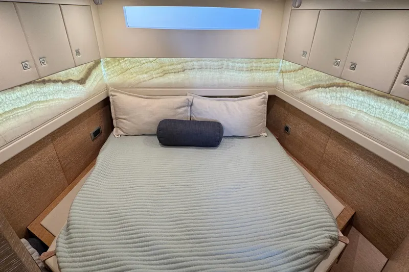 You Only Live Twice Yacht Photos Pics Luxurious cabin interior of 2020 Scout 530 LXF yacht with elegant bedding.
